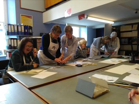Truro Society volunteers at The Courtney Library receiving training